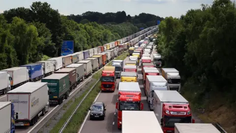 PA Operation Stack: Lorries are backed up on the M20 motorway in Ashford, Kent, July 29th 2015