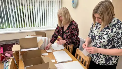 Emma and Fiona'n preparing the certificates
