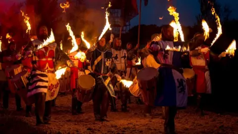 Eleven Arches/Kynren Drummers with flaming drum sticks
