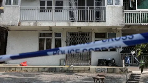 Shutterstock A police cordon restricts access to a village house where the remains of Hong Kong model Abby Choi were found