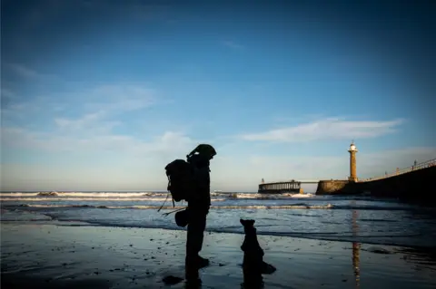 Stewart and Cariad on the beach in Whitby