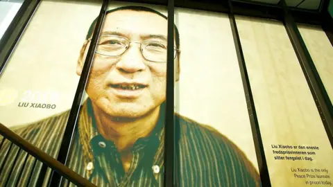 Getty Images A picture of the 2010 Nobel Peace Prize Laureate Liu Xiaobo is seen at The exhibition ?Be Democracy? at The Nobel Peace Center on October 11, 2014 i