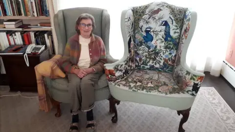 Diana Armitage Nanny Pat sitting next to her chair