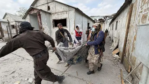Bodies are removed following reported Pakistani airstrikes in Kabul, Afghanistan on March 17, 2026. Afghan officials said the strikes allegedly hit a drug rehabilitation centre in the capital, causing civilian casualties. 