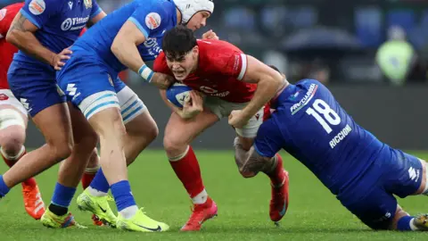 Eddie James carries the ball for Wales against Italy in Rome