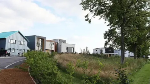 GHVDC A general view picture of a handful of self-build houses opposite a wooded area on the Graven Hill estate.
