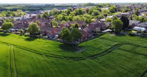 PA Media Aerials hot of Makerfield constituency showing green fields and a housing. estate
