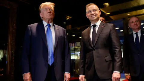 Getty Images Mr Duda, dari Partai Pis Sayap Kanan, adalah pendukung jangka panjang Presiden Trump