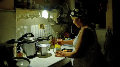 Reuters Havana resident Araselys Rodriguez makes coffee during the blackout