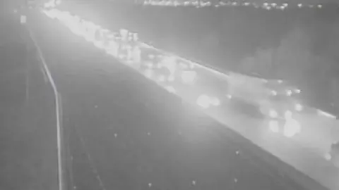 National Highways A black and white image from a highways camera.