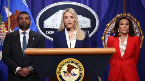 US Attorney General Pam Bondi (center) speaks at a press conference announcing the arrest of a suspect in the 2012 Benghazi attack 