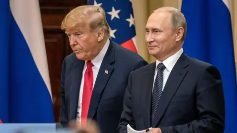 Getty Images Donald Trump and Vladimir Putin stand side by side at a news conference in 2018