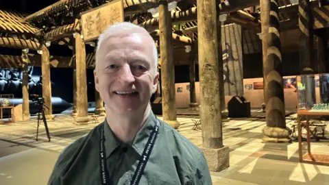 Photograph of John McGrath from Factory International. He is pictured at the Ai Weiwei exhibition at Manchester's Aviva Studios.