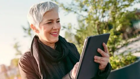 Getty Images A woman using a tablet computer