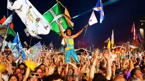 PA Media Audience watching Elton John at Glastonbury