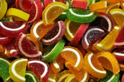 Victor Tregubov Candied sweets shaped similar  citrus segments of assorted  colours connected  merchantability  successful  a market