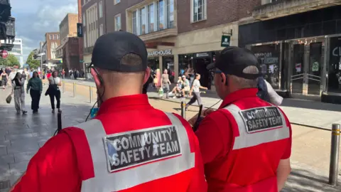 BBC Two members of the Community Safety Team on Exeter High Street