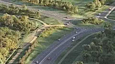 A dual carriageway and roundabout runs through fields in Norfolk.