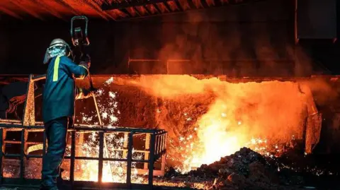 A worker at the blast furnace 