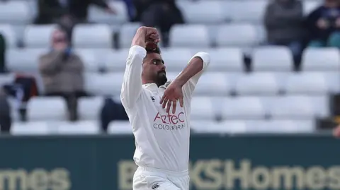 Shafiqullah Ghafari bowling for Durham last summer in Championship whites