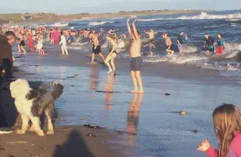 People taking part in a New Year's Day dip at Whitley Bay, North Tyneside