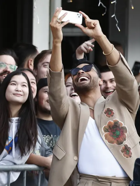EPA Zimbabwean actor Regé-Jean Page takes a selfie with fans on the red carpet for Dungeons & Dragons: Honor Among Thieves.