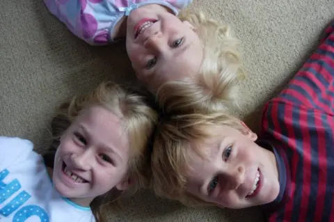 Debs Mitchell Tom, pictured with his sisters Maddy and Evie
