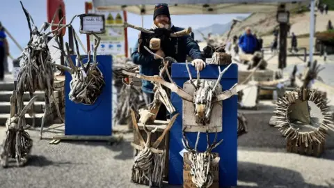 Dan Wakeman Display of art on West Bay beach