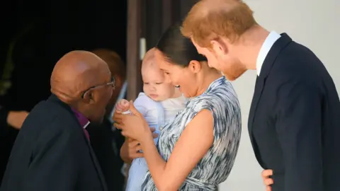 AFP Prince Harry, his wife Meghan and their son Archie meet Archbishop Desmond Tutu in Cape Town, South Africa in September 2019