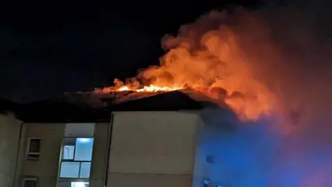 Fife Jammers Flames spread through the roof of the building on Francis Street