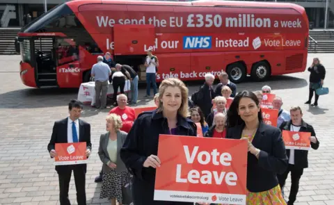 Getty Images Vote Leave campaigners with a campaign bus behind them that says "We sent the EU £350 million a week"