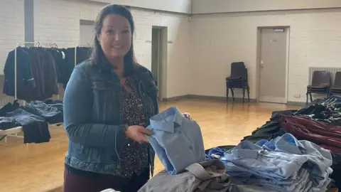 Keeva Watson Keeva Watson from ROC NI holding uniforms