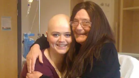 Éimi Quinn Eimi hugging her grandma on a hospital bed