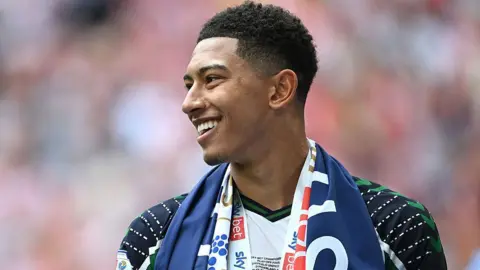 Jobe Bellingham smiles after winning promotion with Sunderland