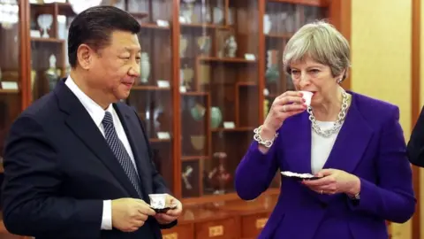EPA Xi Jinping and Theresa May