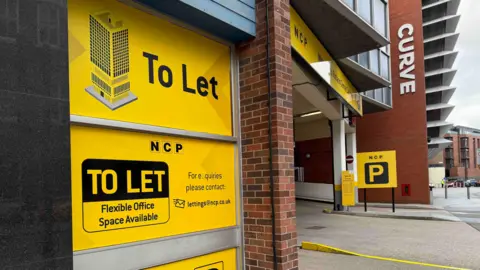 The front of Rutland Centre car park which has To Let signage
