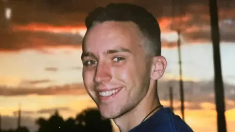 Greg Daily A young Greg Daily smiles at the camera