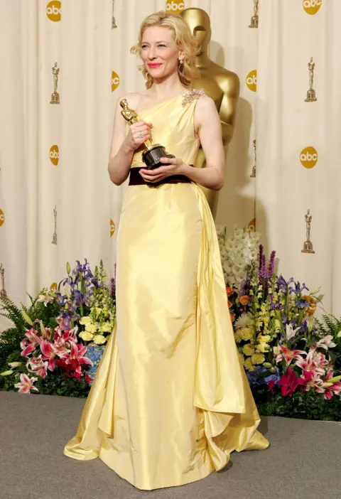 Getty Images Actress Cate Blanchett poses with her "Best Performance by a Supporting Actress" award for "The Aviator" backstage during the 77th Annual Academy Awards on February 27, 2005 at the Kodak Theater in Hollywood, California.