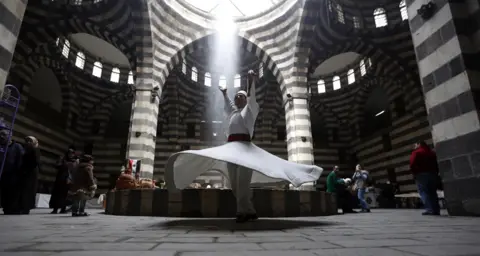 YOUSSEF BADAWI/EPA Dervish dancers performs during an event titled "the Festival of the Syrian Bread held at Khan Asaad Basha in the old city of Damascus, Syria, on 1 April 2019.