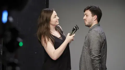 Macmillan Cancer Support/Rankin Ted about to be shaved by Hannah