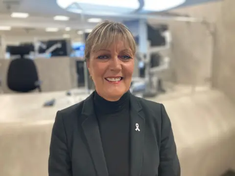 Durham's Police and Crime Commissioner Joy Allen, who is wearing all black, stands in the new police custody suite