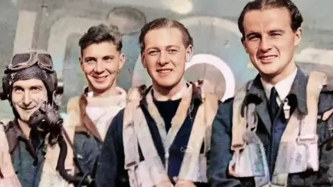 Visit Horsham A World War Two phtograph of four airmen, wearing flying kit over their uniforms, posing smiling in front of an aircraft.