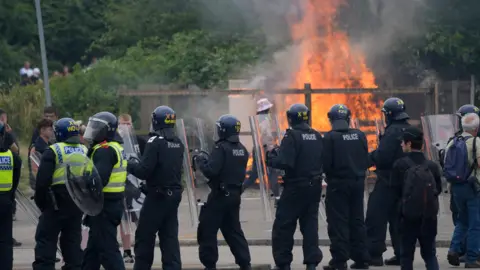 PA Media Trouble flares during an anti-immigration demonstration outside the Holiday Inn Express in Rotherham