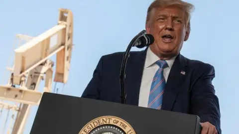 Donald Trump delivers a speech during a tour of the Double Eagle Energy Oil Rig in Midland, Texas