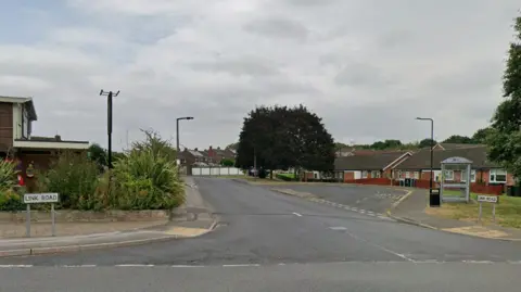Google A road junction looking down a small residential street. The road signs read 'Link Road'.