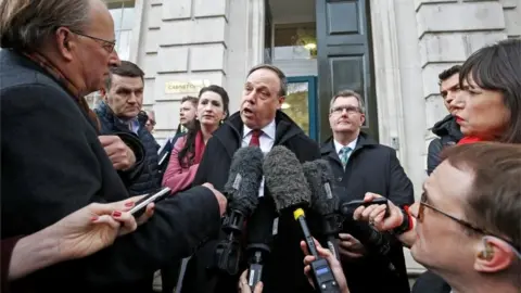 Reuters Nigel Dodds speaks to media