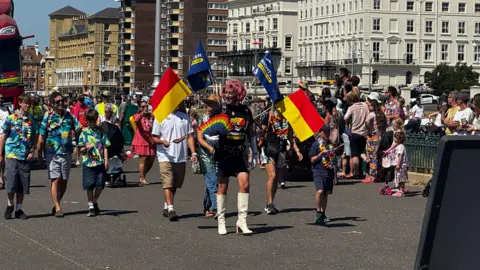 People protest with banners.