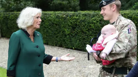 PA Media Camilla met families