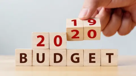 Getty Images Wooden cube block with word 'BUDGET'