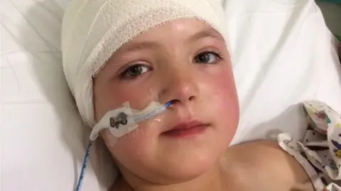 Family Photo Seren in a hospital bed